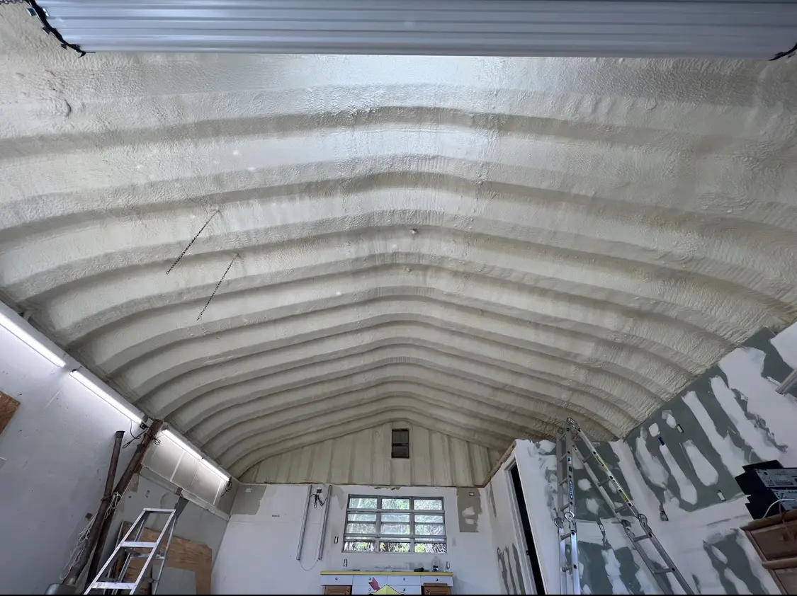 Spray polyurethane foam applied to the underside of a metal roof deck in Thomaston